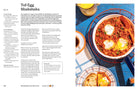 Hardcover book titled "Anything You Can Cook, I Can Cook Vegan" by Insight Editions, featuring a colorful cover design.