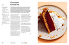Hardcover cookbook titled "Anything You Can Cook, I Can Cook Vegan" by Insight Editions, featuring colorful plant-based dishes.