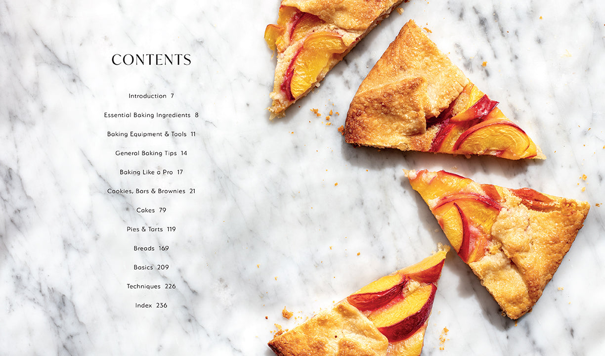 Hardcover Baking Favorites cookbook by Insight Editions featuring a colorful cake and baking tools on the cover.