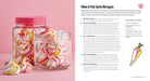 Hardcover book titled Barbie Bakes! by Insight Editions, featuring colorful illustrations and images of Barbie-themed baking scenes.