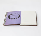 Hardcover Beetlejuice: Handbook for the Recently Deceased journal by Insight Editions with ruled pages and spooky design.