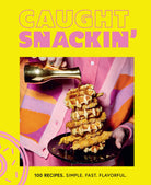 Hardcover book titled "Caught Snackin'" by Insight Editions featuring colorful snack-themed cover art.