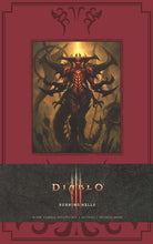 Large hardcover Diablo Burning Hells journal by Insight Editions with dark, fiery artwork on the cover and blank pages inside.