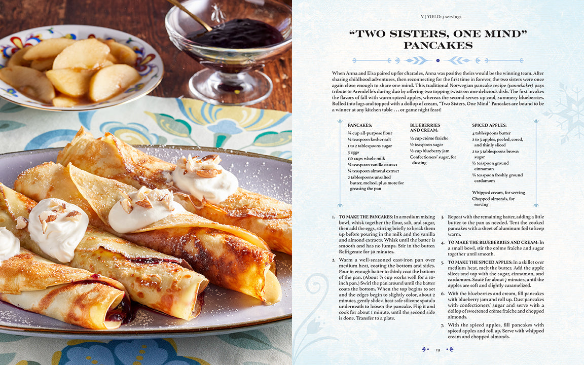 Hardcover Disney Frozen: The Official Cookbook by Insight Editions featuring colorful pages and Frozen-themed recipes.