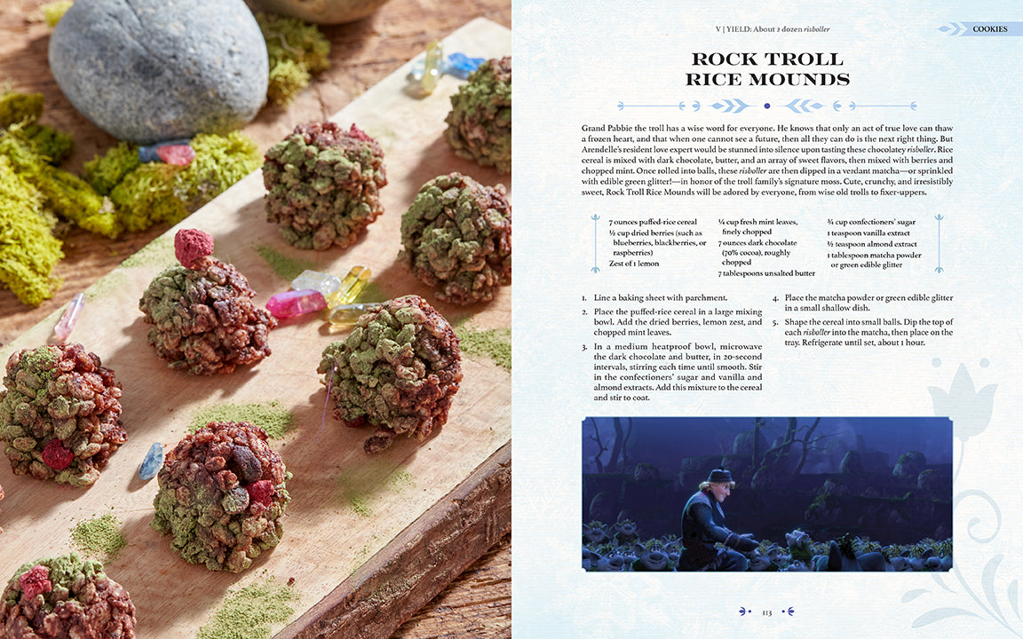 Hardcover Disney Frozen: The Official Cookbook by Insight Editions, featuring colorful pages and images of Frozen-themed recipes.