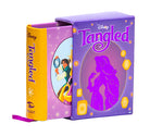 Hardcover Disney Tangled book by Insight Editions featuring illustrations and story content from the animated film.