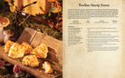 Hardcover of Dragon Age: The Official Cookbook by Insight Editions, featuring fantasy-themed recipes and artwork.