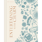 Hardcover book titled "Entertaining with Charm" by Insight Editions, featuring a charming cover design.