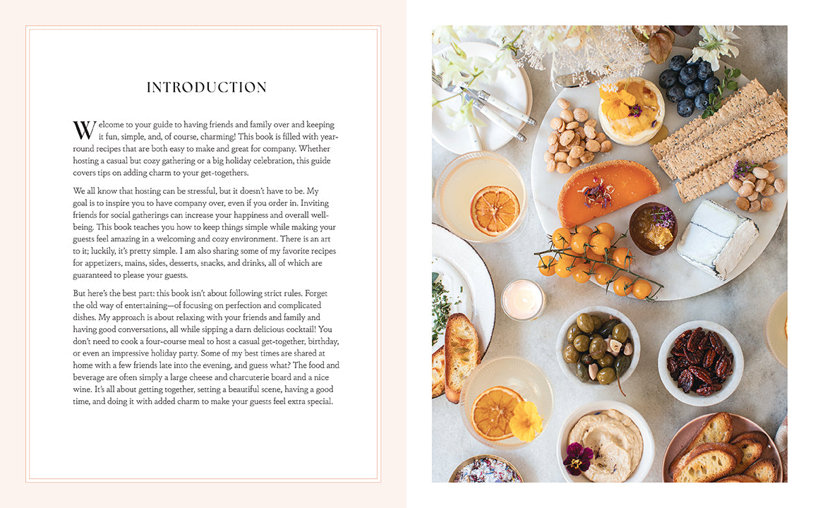 Hardcover book titled "Entertaining with Charm" by Insight Editions, featuring decorative interior pages and charming design elements.