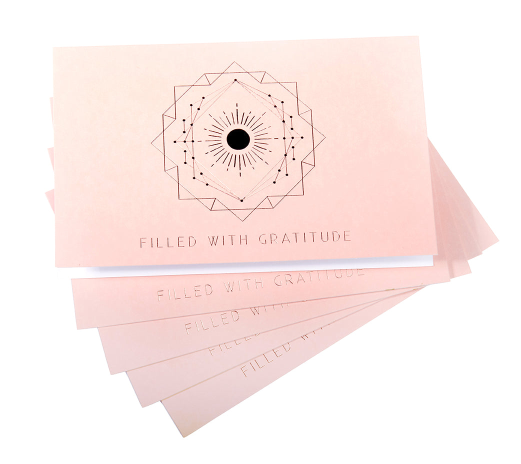 Hardcover book titled "Filled with Gratitude" by Insight Editions, featuring a decorative cover with warm tones.