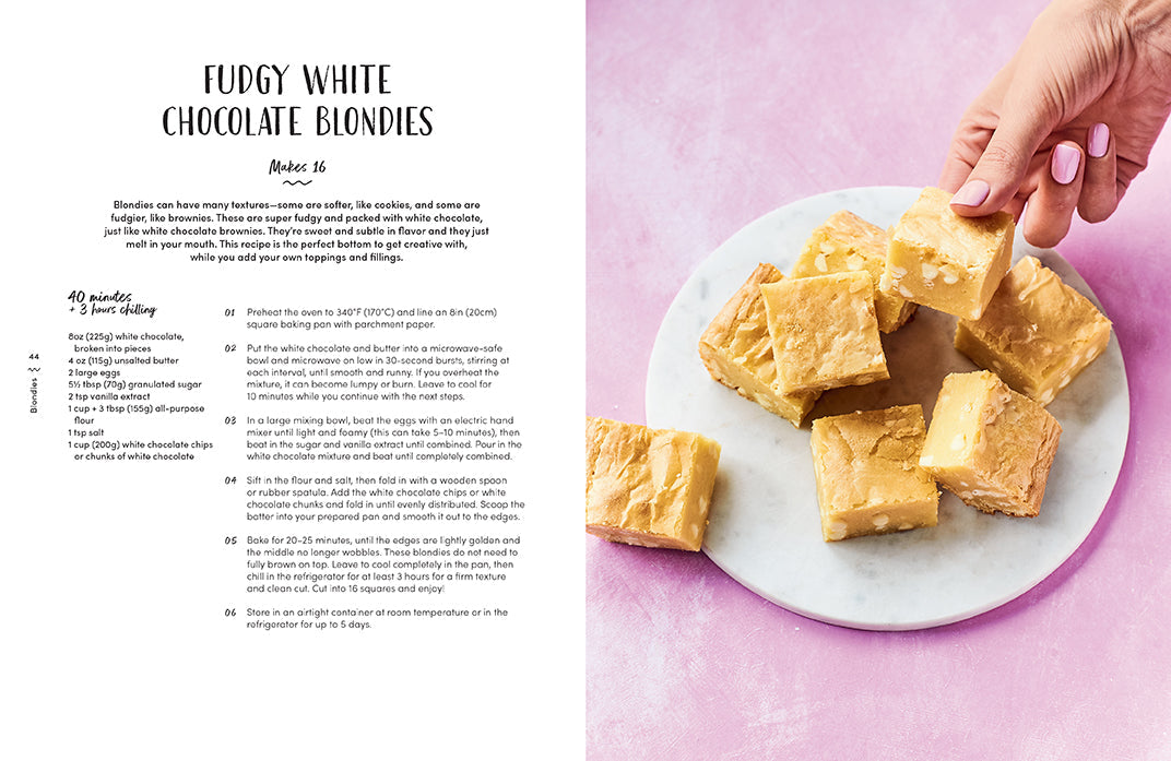 Hardcover copy of Fitwaffle's Baked in One cookbook by Insight Editions featuring a colorful cover with baked goods.