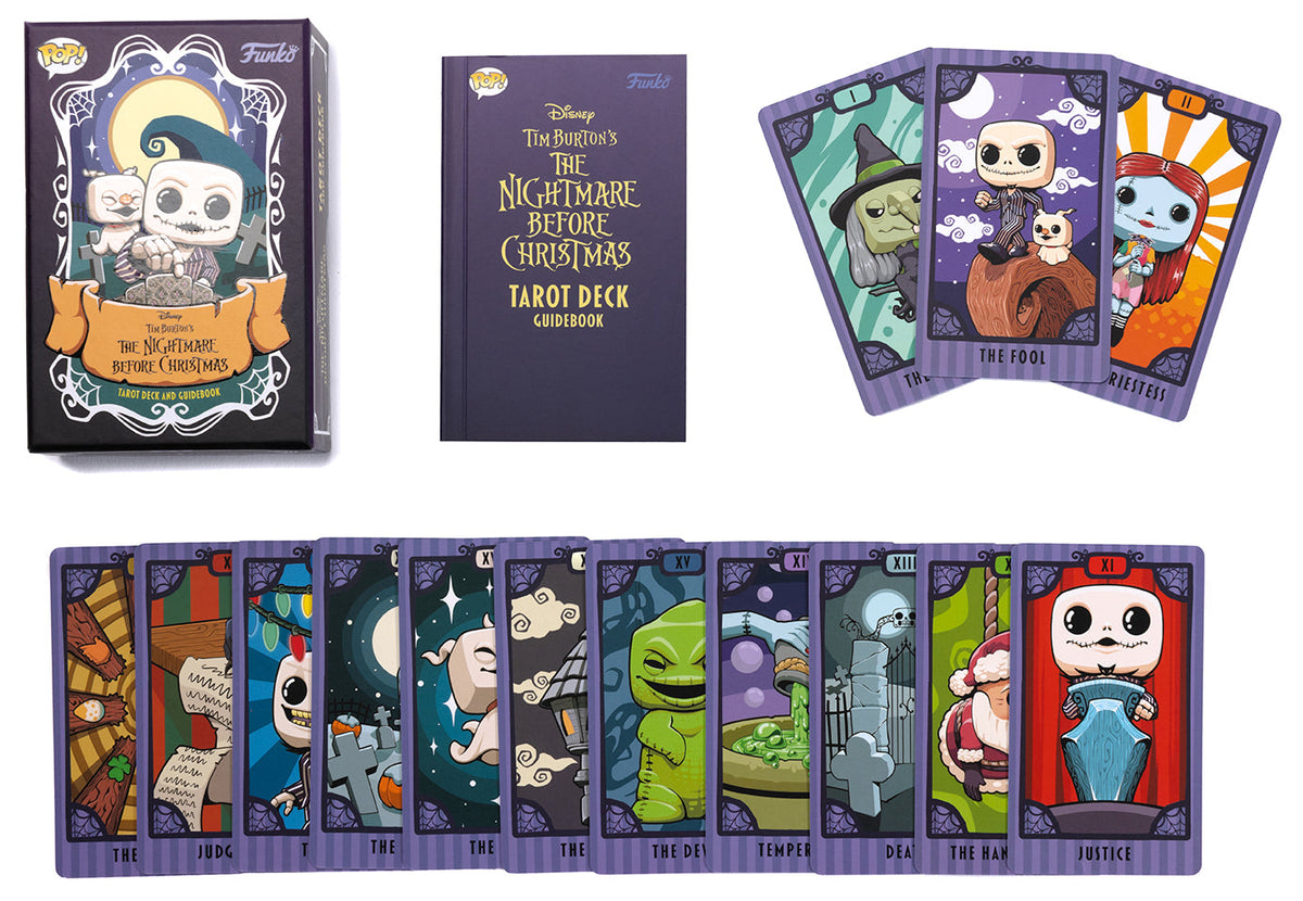Inside view of the hardcover Insight Editions Nightmare Before Christmas tarot deck and guidebook featuring illustrated cards and booklet pages.