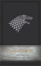 Large hardcover Game of Thrones House Stark journal by Insight Editions with ruled pages and House Stark sigil design.