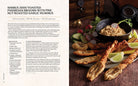 Hardcover Harry Potter and Fantastic Beasts cookbook by Insight Editions featuring Wizarding World recipes and magical illustrations.