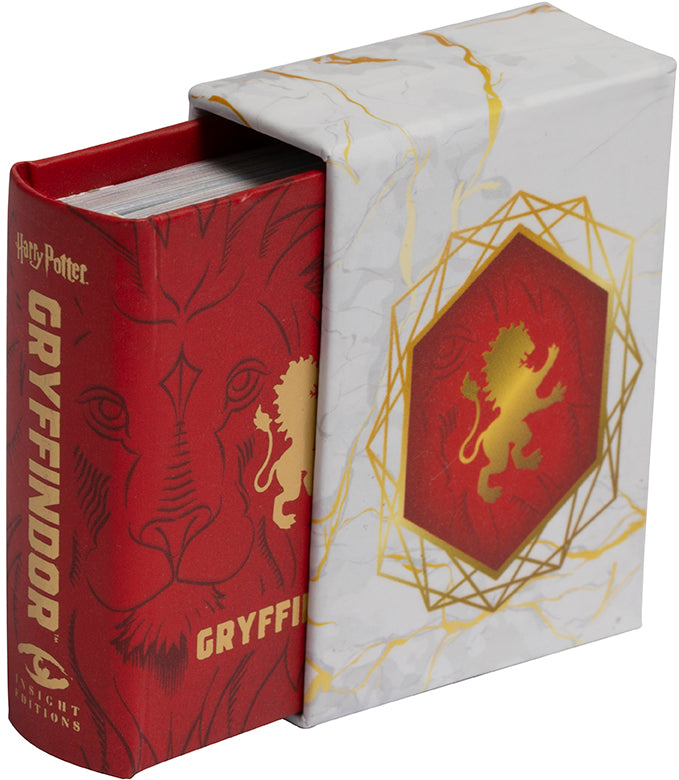 Hardcover Harry Potter Gryffindor book by Insight Editions with the iconic Gryffindor crest on the cover.