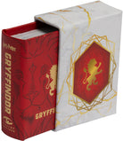 Hardcover Harry Potter Gryffindor book by Insight Editions with the iconic Gryffindor crest on the cover.