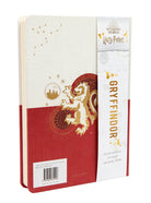 Harry Potter Gryffindor constellation hardcover ruled journal with wizard-themed cover design and gold accents, by Insight Editions.
