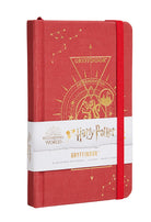 Hardcover Harry Potter Gryffindor Constellation Ruled Pocket Journal with a celestial design, featuring the Gryffindor crest and starry pattern.