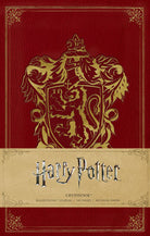 Hardcover Harry Potter Gryffindor ruled pocket journal with Hogwarts crest and red and gold design by Insight Editions