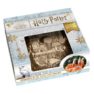 Hardcover Harry Potter: Hogwarts in the Snow Cake Pan Set by Insight Editions showing the festive snow-themed Hogwarts design.