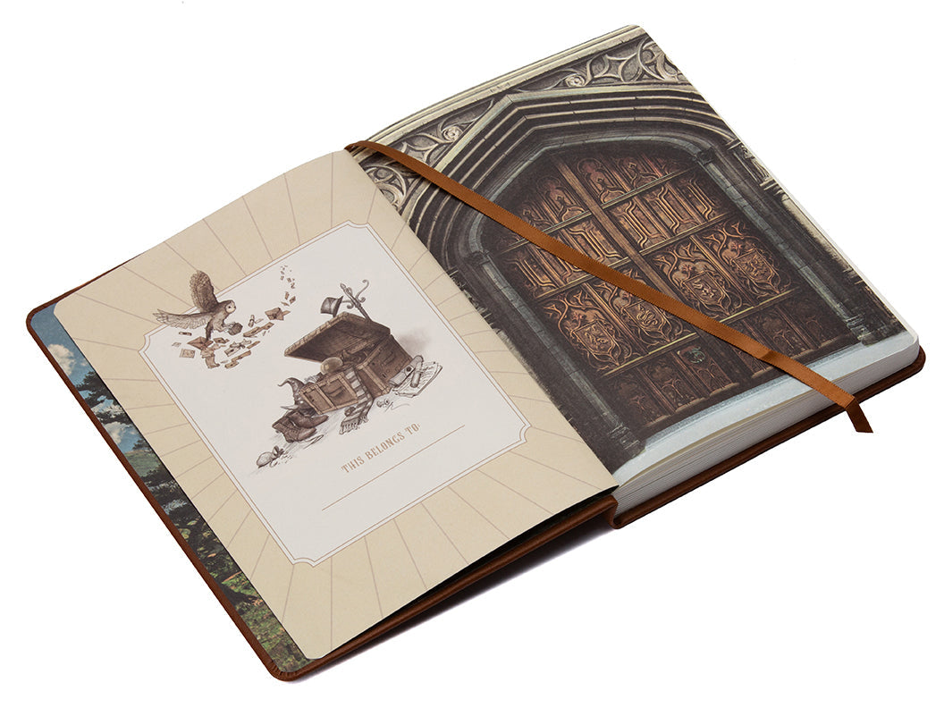 Hardcover Harry Potter Hogwarts Legacy Journal by Insight Editions with embossed Hogwarts crest on the cover.