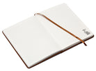 Hardcover Harry Potter: Hogwarts Legacy Journal by Insight Editions with embossed Hogwarts crest on the cover.