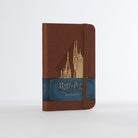 Hardcover Harry Potter Hogwarts ruled pocket journal by Insight Editions, featuring magical Hogwarts-themed cover design.