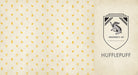 Hardcover Harry Potter Hufflepuff ruled journal with Hufflepuff crest and yellow accents, by Insight Editions.