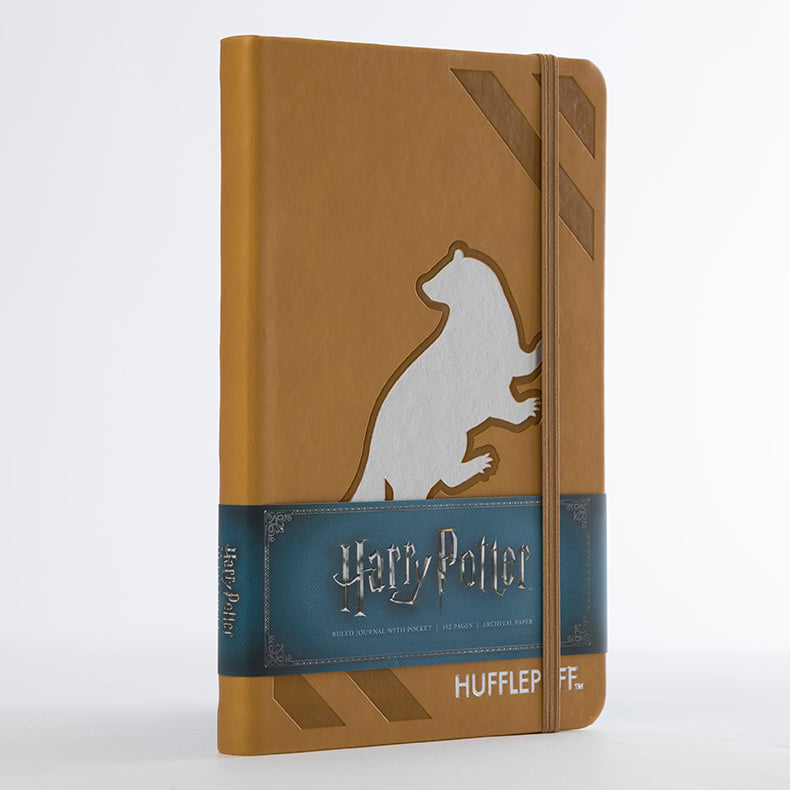 Harry Potter Hufflepuff hardcover ruled journal by Insight Editions with Hufflepuff crest and gold accents on the cover.