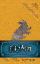 Hardcover Harry Potter Hufflepuff ruled pocket journal by Insight Editions, featuring Hufflepuff crest and yellow accents.