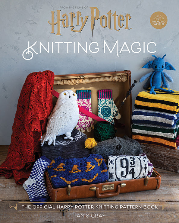 Hardcover copy of Harry Potter: Knitting Magic book by Insight Editions, featuring magical knitting patterns and illustrations.