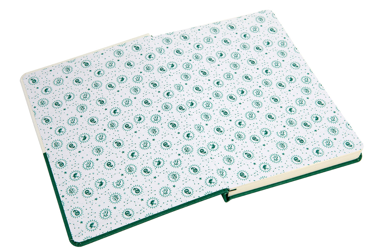 Inside view of the Harry Potter Slytherin Constellation hardcover ruled journal by Insight Editions, featuring starry Slytherin design pages.