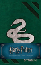 Harry Potter Slytherin hardcover ruled journal with green cover and Slytherin emblem, perfect for note-taking and writing.