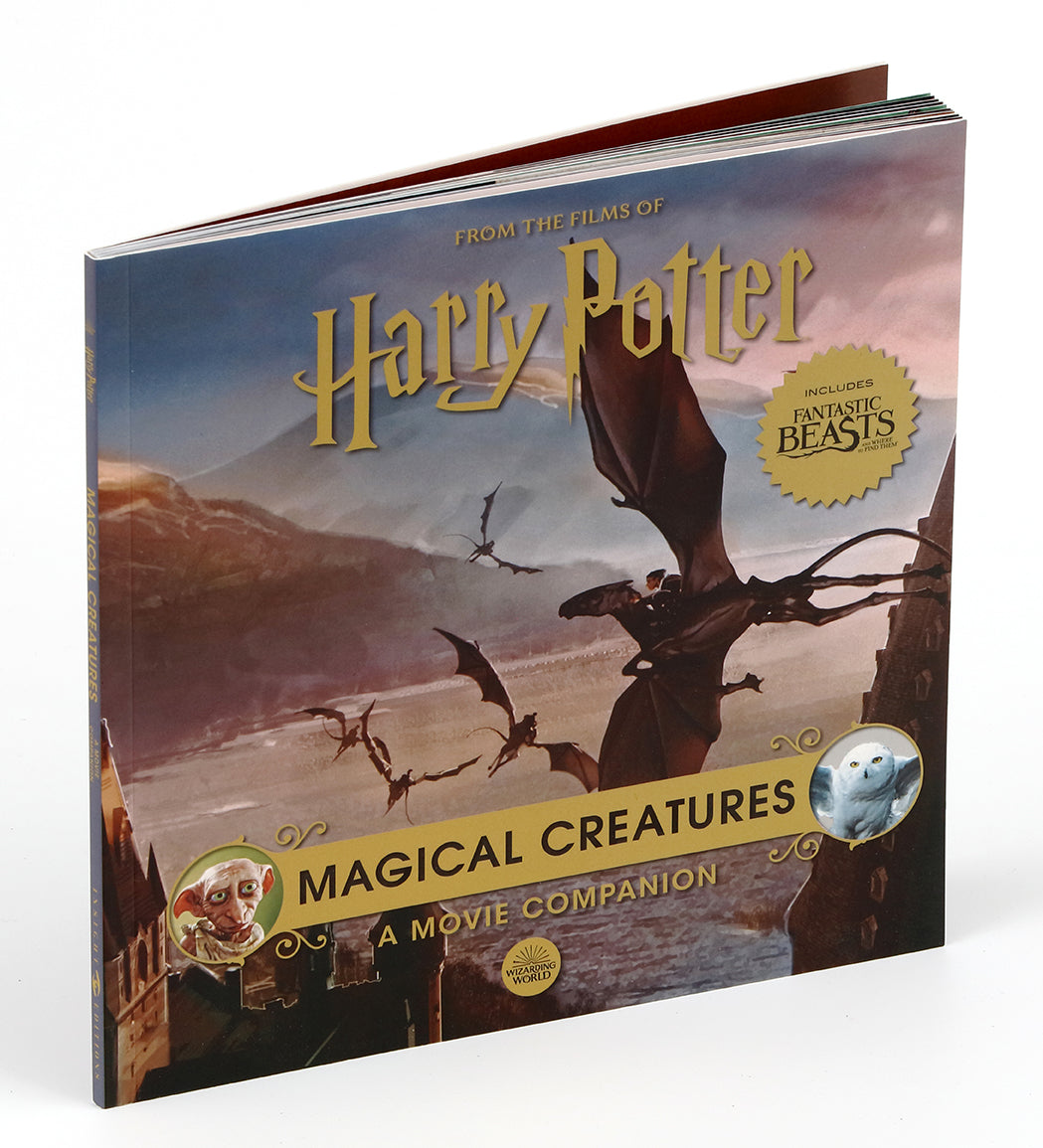 Hardcover Harry Potter Monster Book of Monsters model and book by Insight Editions, featuring detailed cover and open pages.