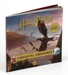 Hardcover Harry Potter Monster Book of Monsters model and book by Insight Editions, featuring detailed cover and open pages.