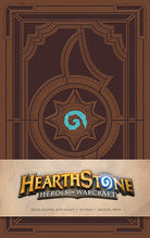 Insight Editions Hearthstone hardcover ruled journal with embossed logo and lined pages, ideal for notes and creative writing.