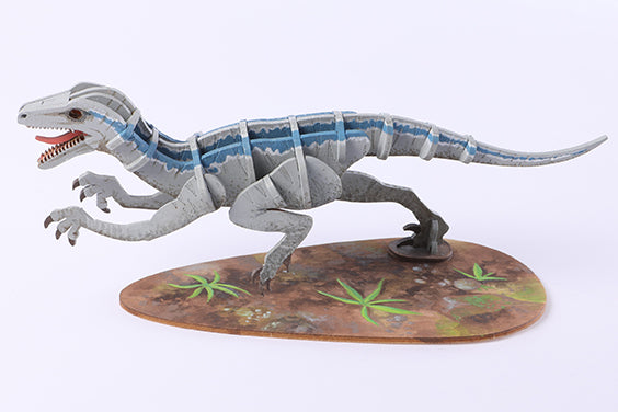 Hardcover Jurassic World Raptor book and 3D wood model by IncrediBuilds, featuring detailed raptor design from Insight Editions.