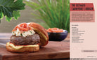 Hardcover of Jurassic World: The Official Cookbook by Insight Editions, featuring colorful dinosaur-themed pages and recipe illustrations.