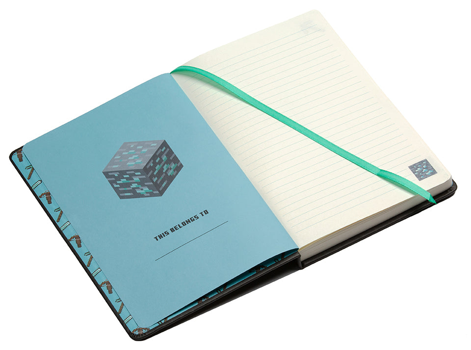 Hardcover Minecraft Diamond Ore Journal with charm by Insight Editions, featuring a detailed diamond ore cover and a decorative charm.