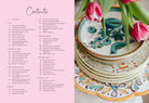 Hardcover edition of Muy Bueno: Fiestas cookbook by Insight Editions featuring vibrant Mexican celebration images