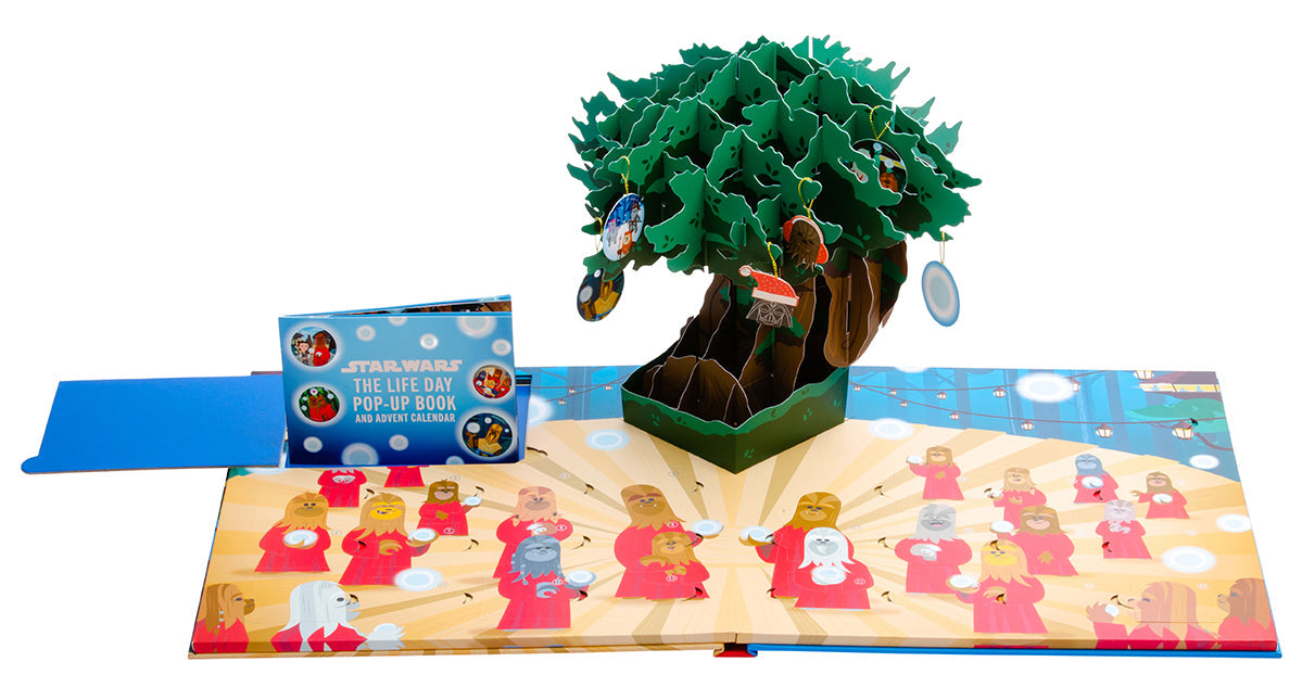 Hardcover Star Wars The Life Day Pop-Up Book and Advent Calendar by Insight Editions showing festive pop-up scenes and holiday designs.