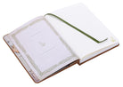 Hardcover The Lord of the Rings journal with charm, featuring intricate design and interior pages for writing and notes.