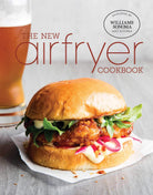 Hardcover Insight Editions cookbook titled "The New Air Fryer Cookbook" with colorful food images on the cover.