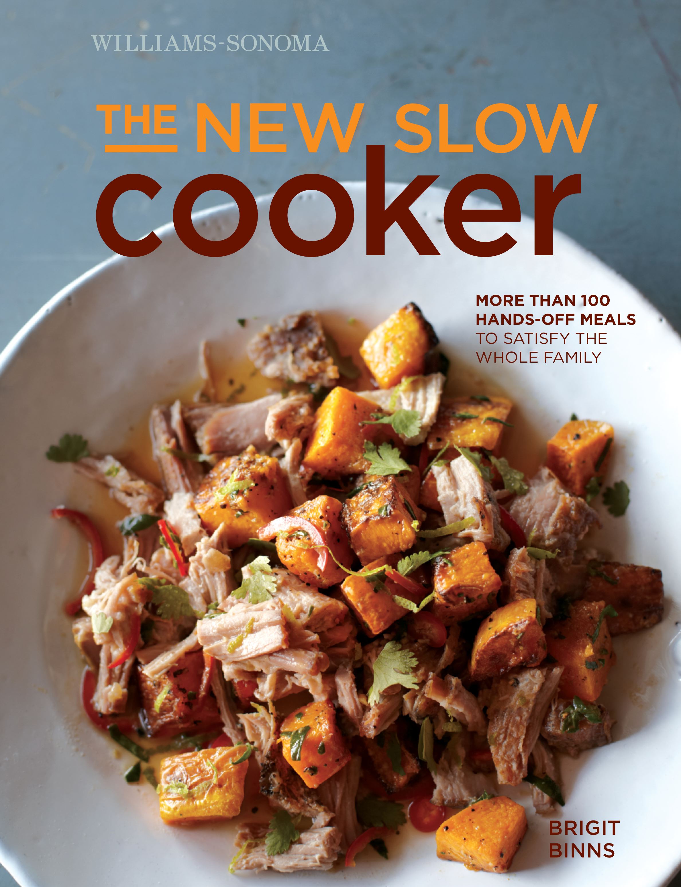 Hardcover book titled "The New Slow Cooker" by Insight Editions, featuring a close-up of the book cover with cooking images.