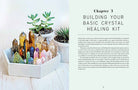 Open hardcover book titled "The Power of Crystal Healing" by Insight Editions, showing colorful crystal illustrations inside.