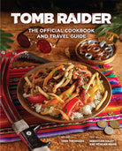 Hardcover of Tomb Raider: The Official Cookbook and Travel Guide by Insight Editions, featuring a colorful cover with adventure-themed artwork.