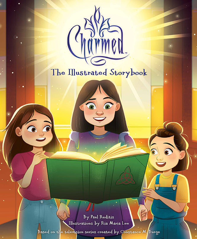 Hardcover edition of Charmed: The Illustrated Storybook with protective jacket by Insight Editions, featuring colorful fantasy artwork.