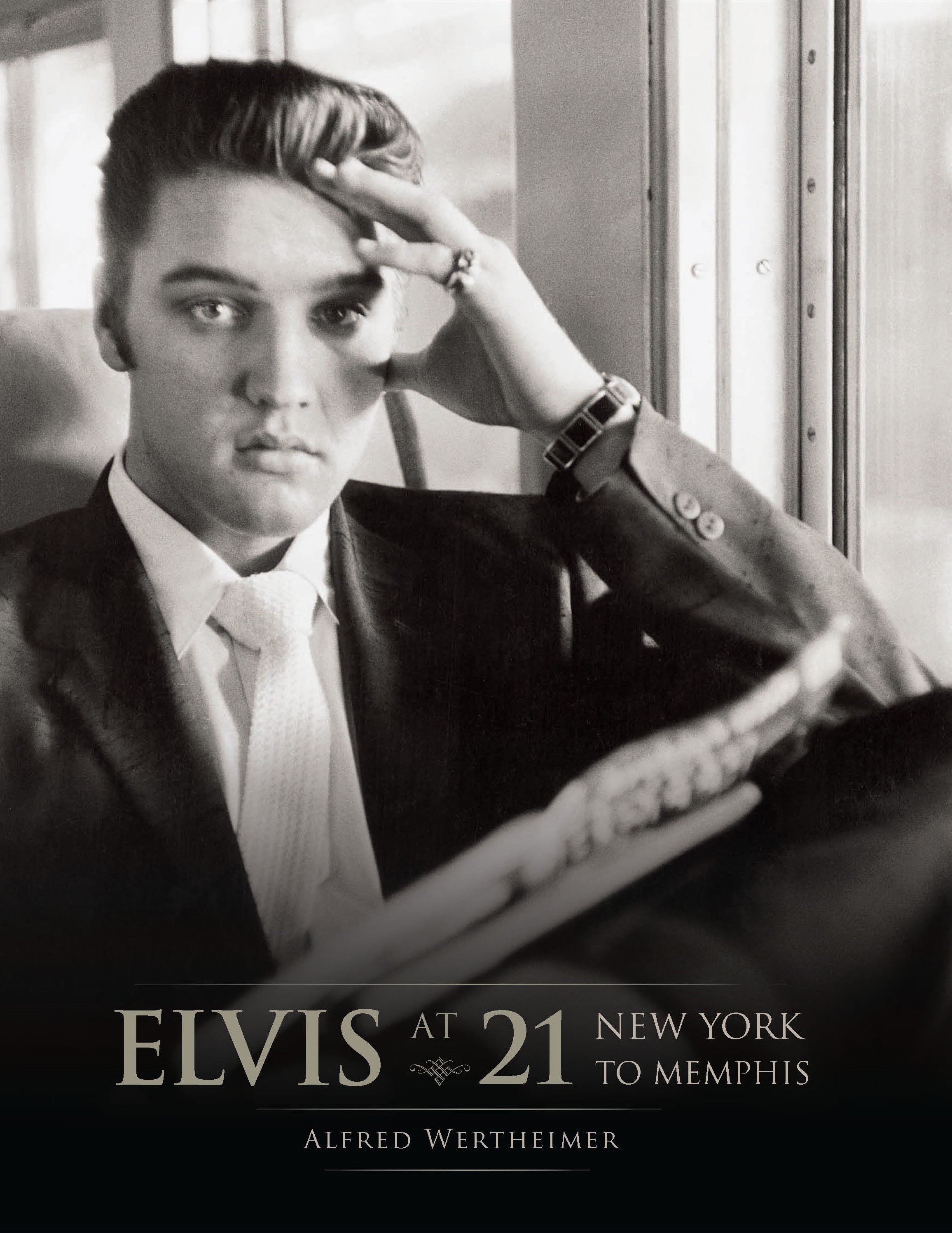 Hardcover edition of "Elvis at 21" with a matching jacket, featuring a photo and design related to Elvis Presley.