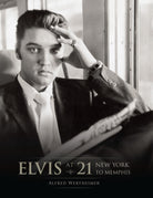 Hardcover edition of "Elvis at 21" with a matching jacket, featuring a photo and design related to Elvis Presley.