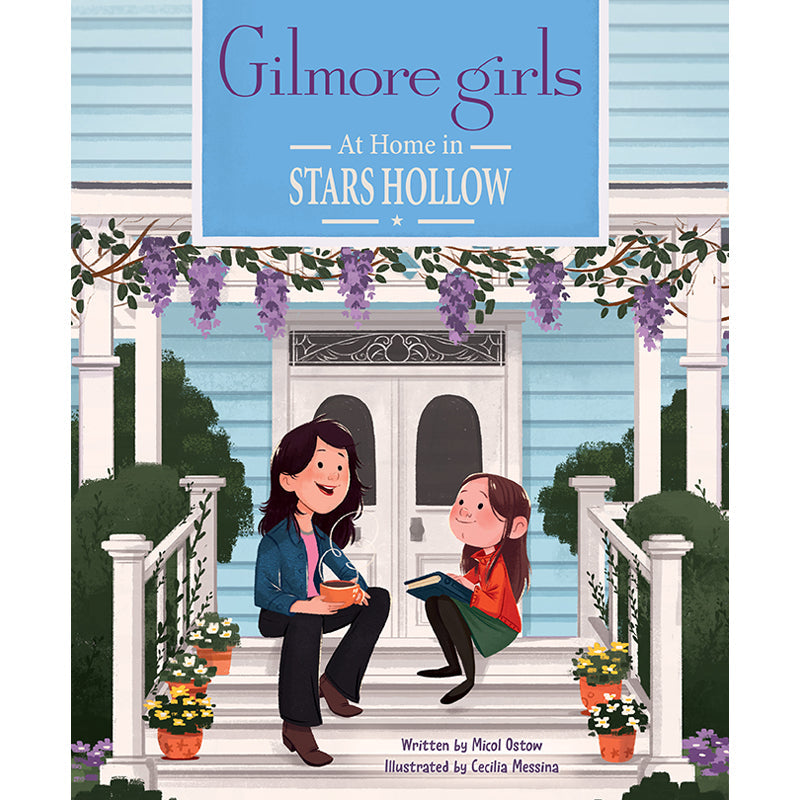 Hardcover book with jacket of "Gilmore Girls: At Home in Stars Hollow" by Insight Editions, featuring a cozy Stars Hollow scene.